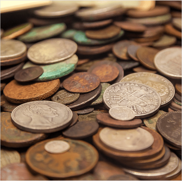 Pile of assorted old coins.